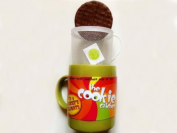 close-up of Cookie Catcher fine mesh catching broken biscuit pieces in tea